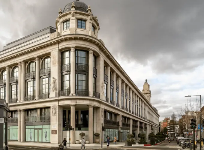 Neoclassical building with dome and columns under cloudy sky