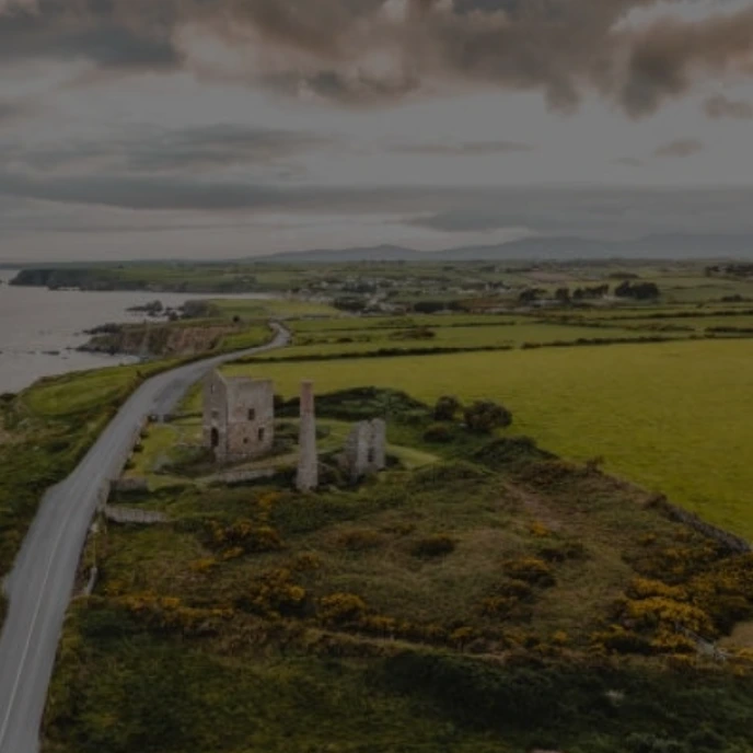 Aerial view of Waterford’s rugged coastline and ancient stone ruins