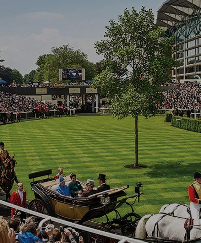 Crowd gathered at Royal Ascot with a horse-drawn carriage and racecourse