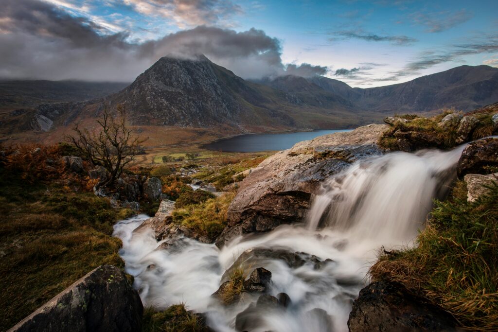 Rugged mountain peaks and green valley landscapes in Snowdonia National Park, Wales.