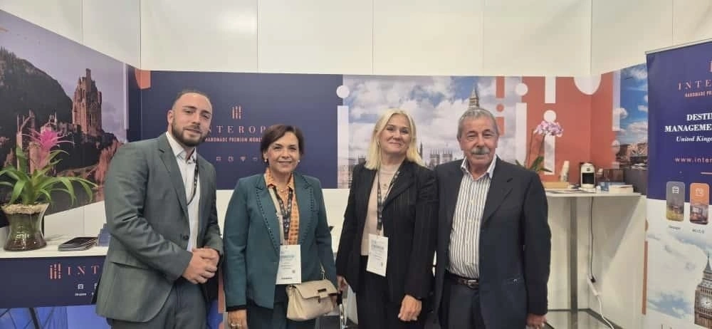 A professional group posing for a photo at a conference.