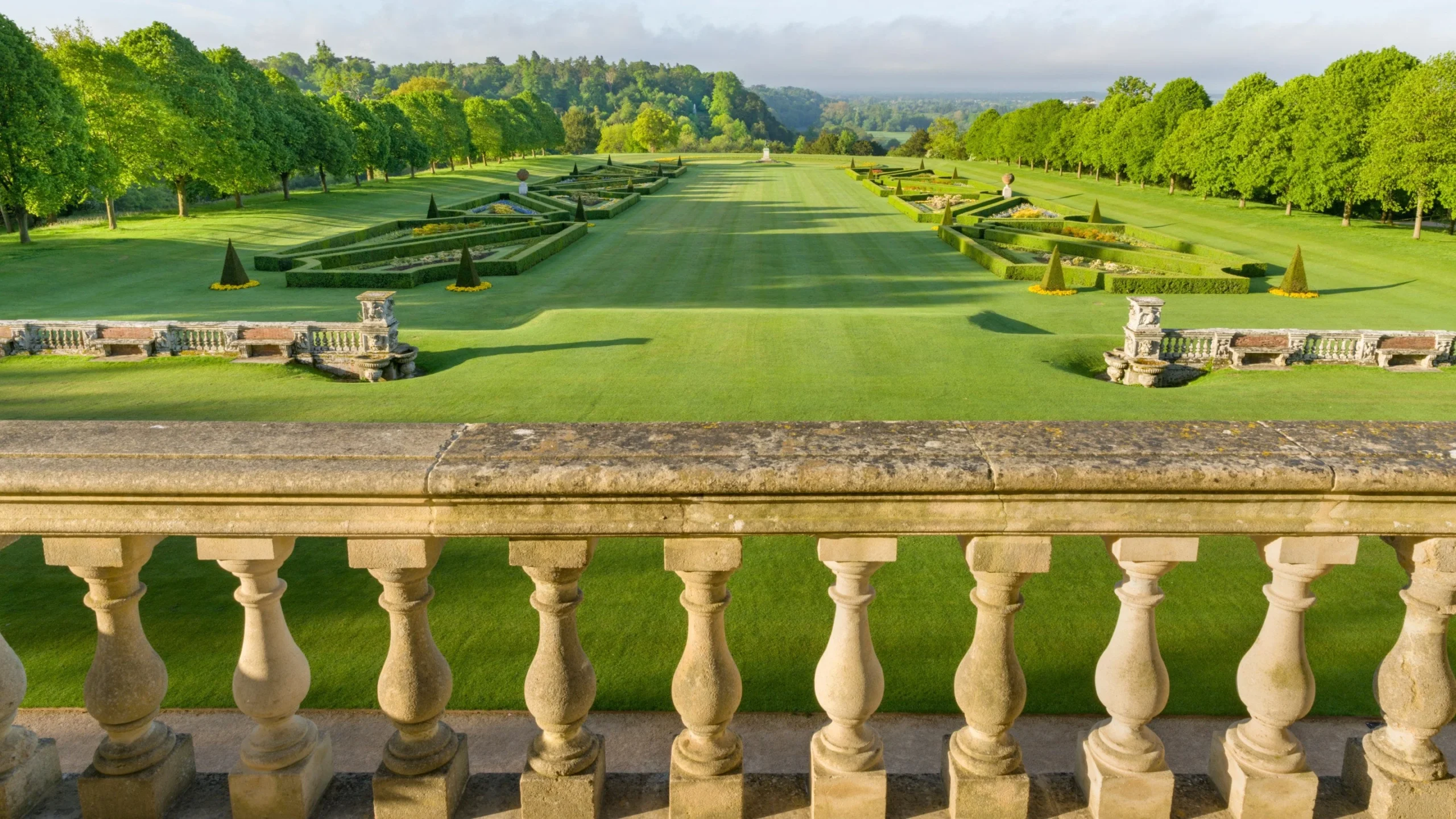 Magnificent Palladian facade of Cliveden House in Berkshire, a legendary English country house hotel with formal gardens and the Thames below