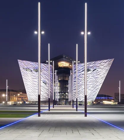 Scenic views of Northern Ireland’s countryside, with lush fields and winding roads under clouds.