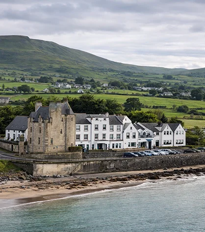 Stunning landscape of Northern Ireland, with rolling hills, green fields, and rugged coastlines.