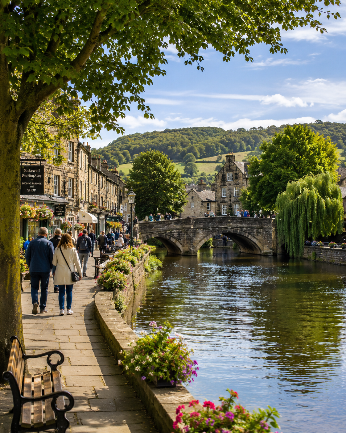 Visitors strolling along the riverside path in the market town of Bakewell