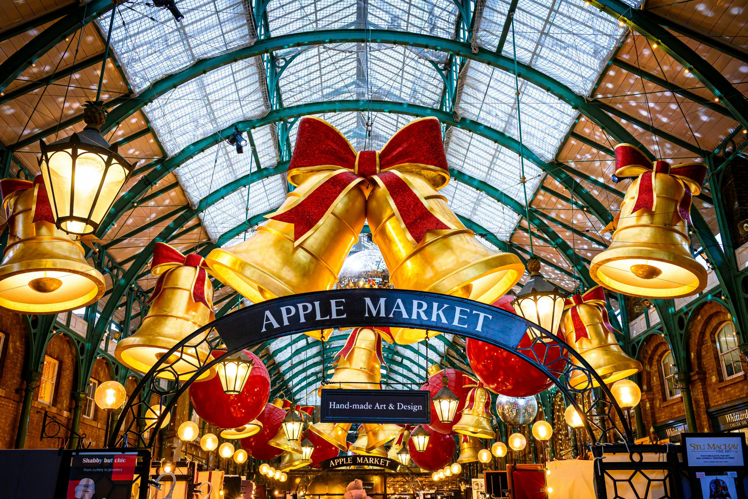 Covered market hall decorated with festive bells and lights for the Christmas season