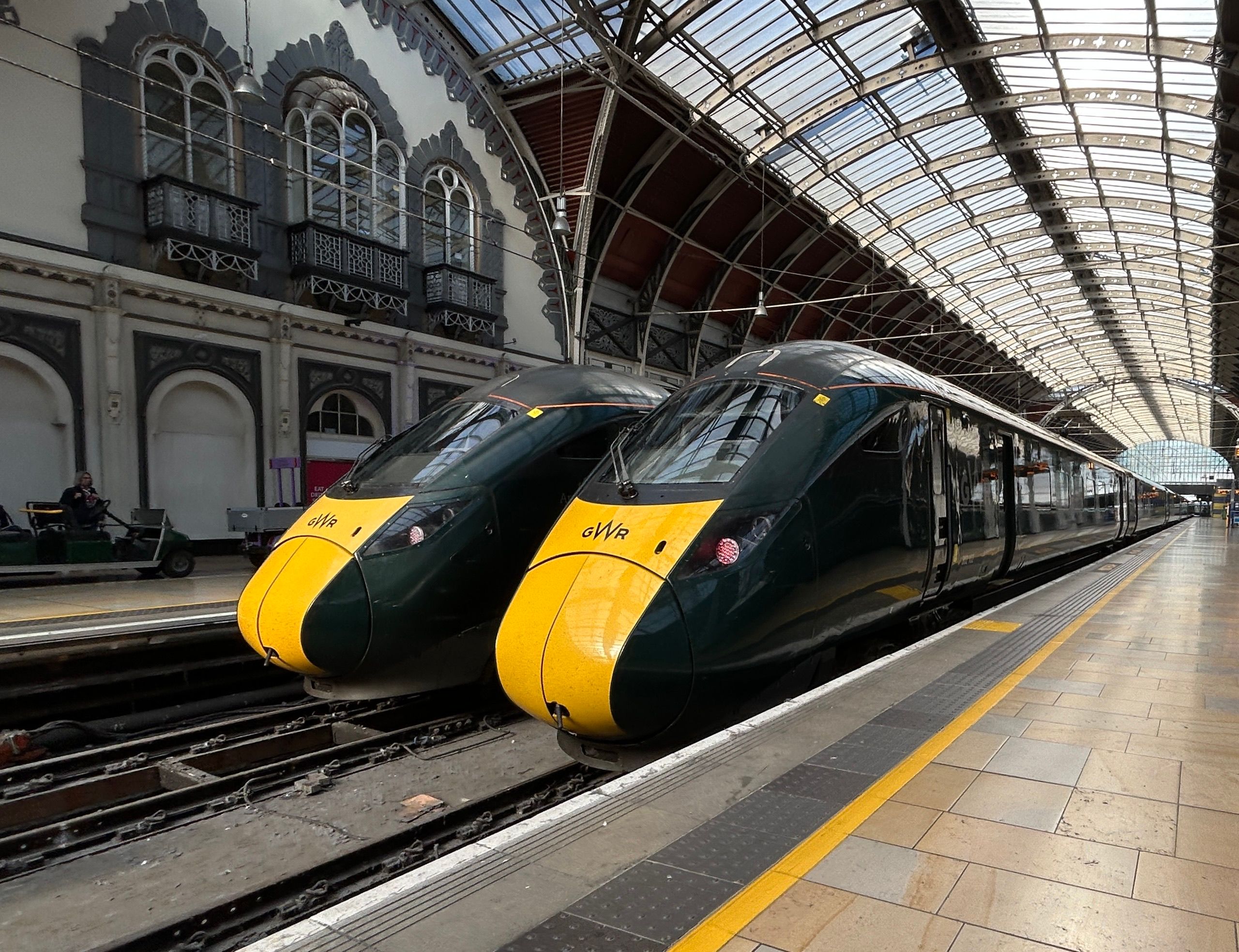 Intercity trains at a historic London railway station platform ready for cross-country rail touring