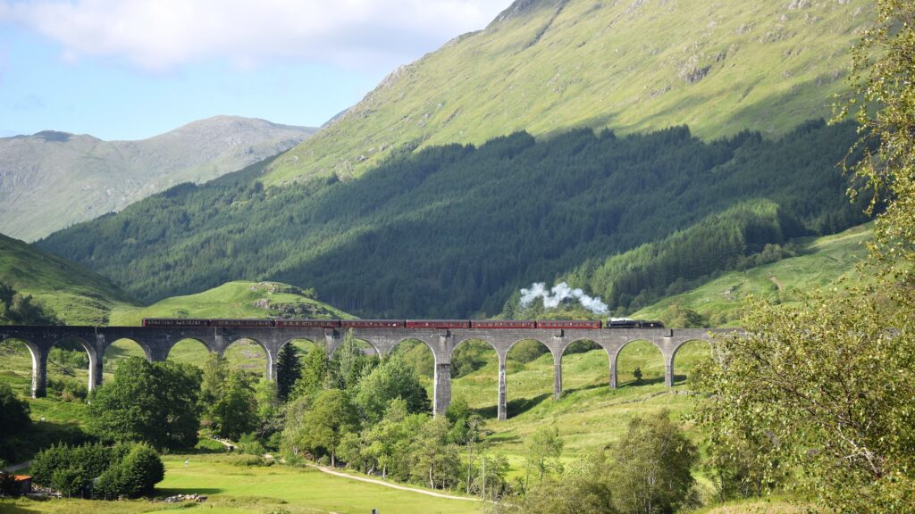 Glenfinnan Viaduct curving through the Scottish Highlands on the Jacobite steam train route