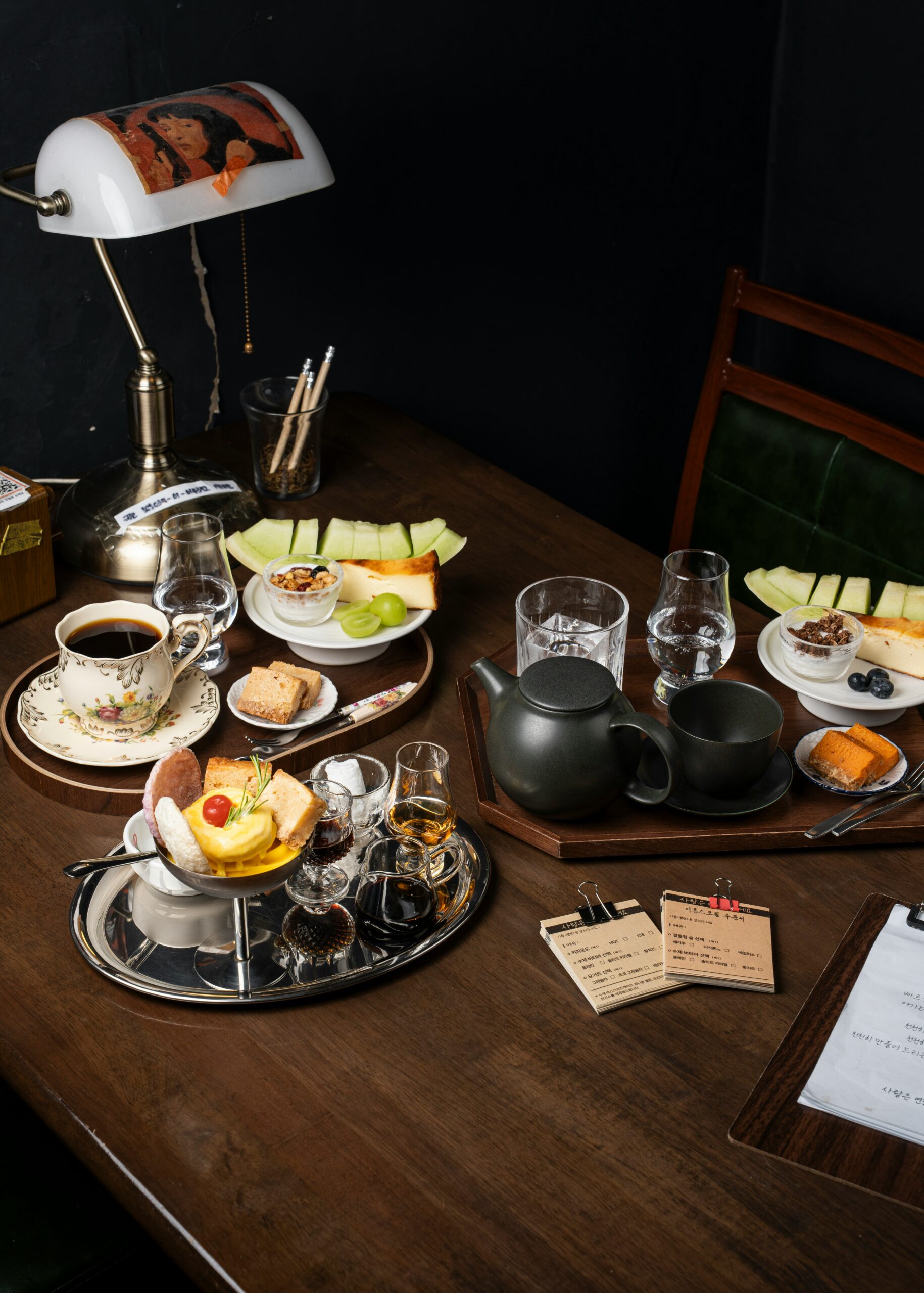 Private British afternoon tea served in an elegant tea room with fine china, pastries, sandwiches and freshly brewed tea.