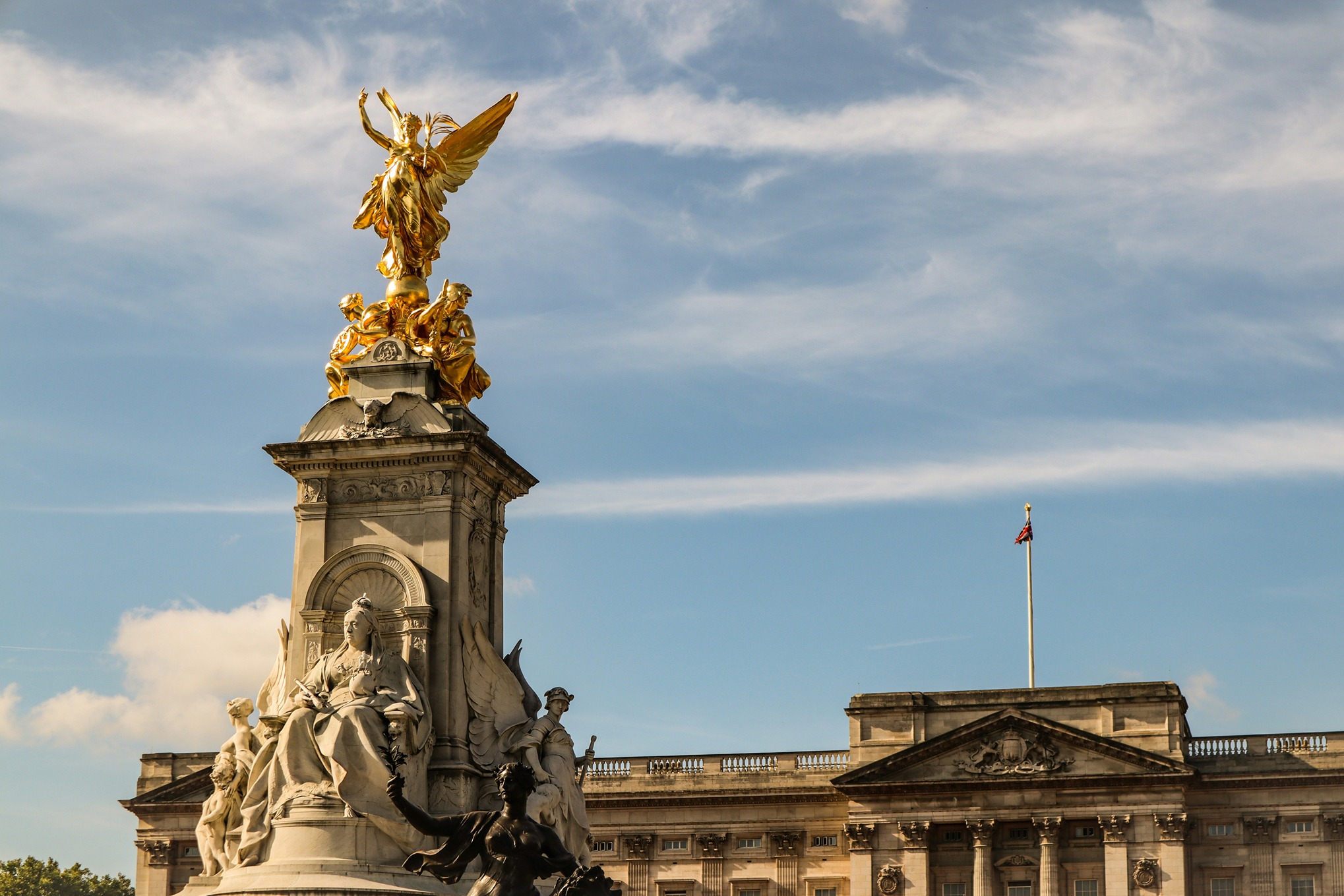Buckingham Palace exterior with the Royal Standard flying above the building